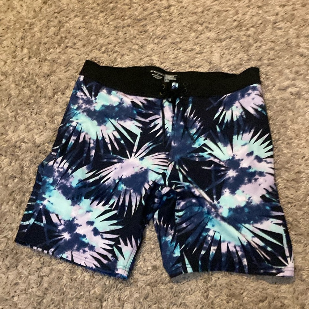 Trying to get rid of clothes. Swim trunks